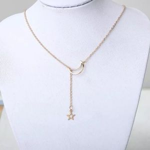 Jewelry - NWT • gold star and moon necklace Jewelry - NWT • gold star and moon necklace